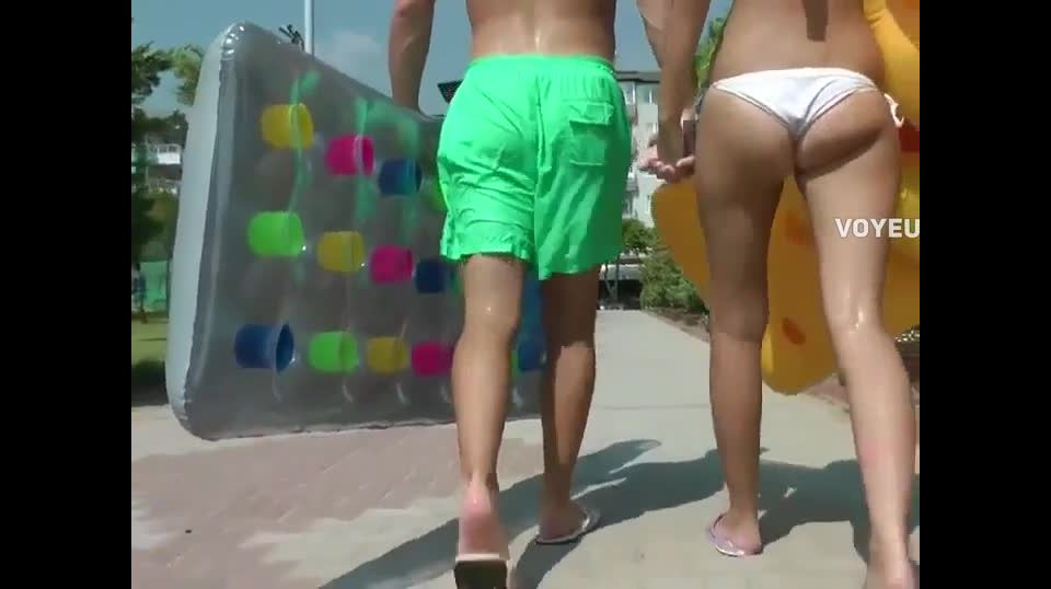 Voyeur follows her tiny ass to the beach Nudism!