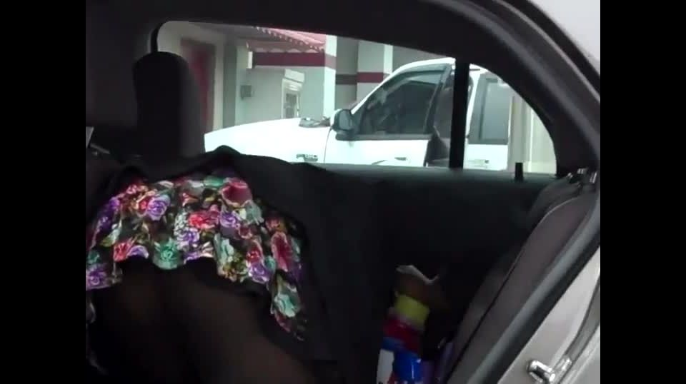 Butt covered with pantyhose in a  car