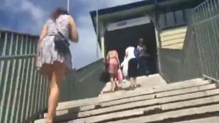 Wind shows her ass while on the  stairs