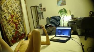 horny girl watching porn and masturbating with toy on the bed. hidden ...