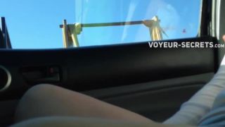 Kinky girl shows off in a moving car