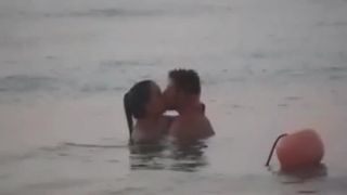 Couple having sex in the water public 