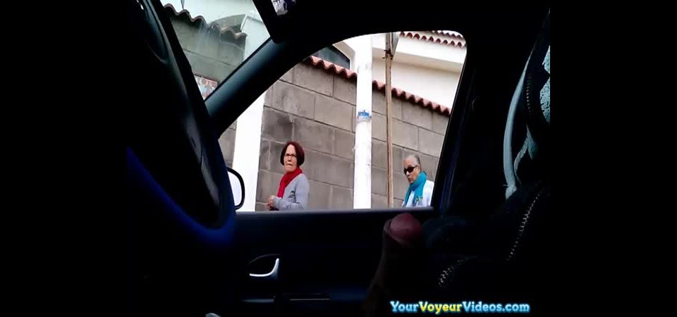 Dude strokes his cock inside his car