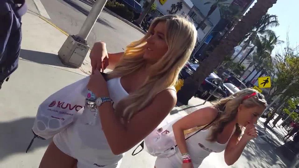 Sexy hostesses handing out free sunglasses