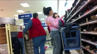 Teenage chick bends down to try  shoes