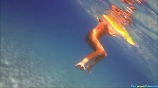 Underwater nudist swimming
