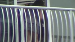 Ebony upskirt on the  balcony