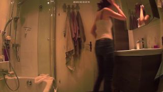 cute slim girl undressing and changing tampon in the bathroom. hidden ...