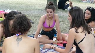 Voyeur zooms in on hippie girl's nice tits