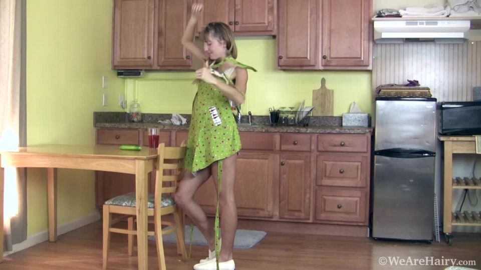 Rosy Heart plays with cucumber in the kitchen