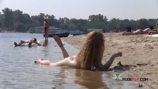Wet and hot nude teens tanning  outdoors
