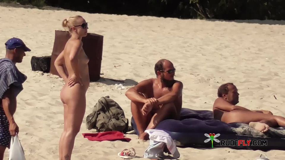 A public strand heats up with two hot teen naturists Teen