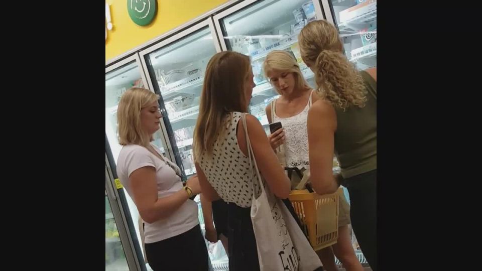 Two upskirts of sexy moms in supermarket