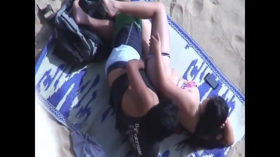 Spooning and fucking on the beach