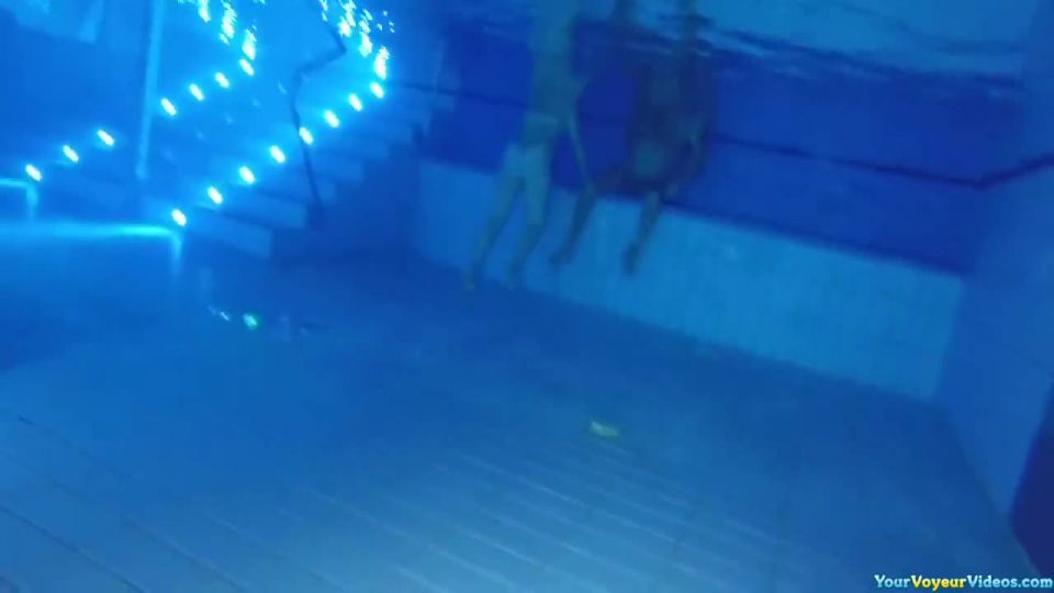 Underwater nude woman swimming
