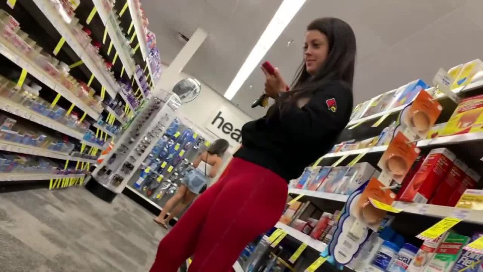 Red leggings matching her sexy toenail polish
