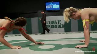 Blond Fitness model & gorgeous brunette battle it out on the mat. Loser gets fucked, must lick pussy Muscle!
