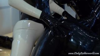 Strap on fuck in full rubber latex 