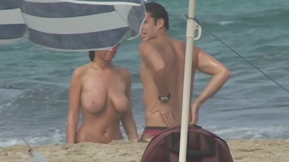 Natural beauty strips nude on beach