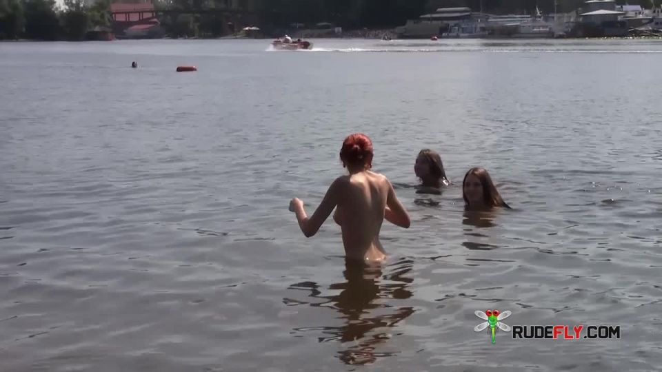 Naked teen nudist lets the water kiss her  body