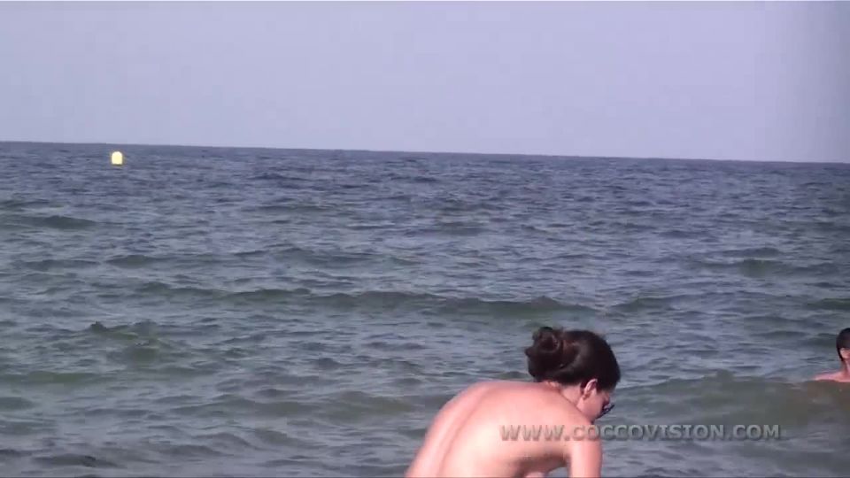 Pretty girl topless on the beach