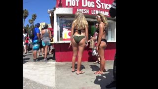 Bubble butts next to a hot dog stand on beach