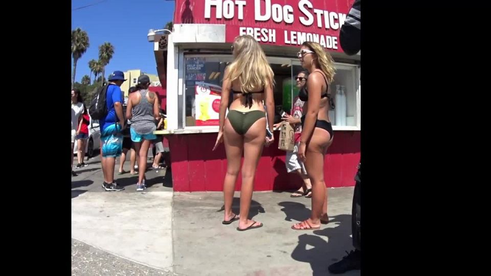 Bubble butts next to a hot dog stand on beach