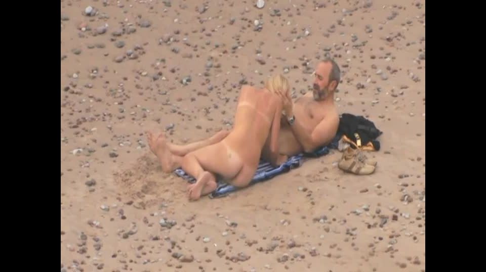 Older guy fucks a teen girl on a beach Voyeur!