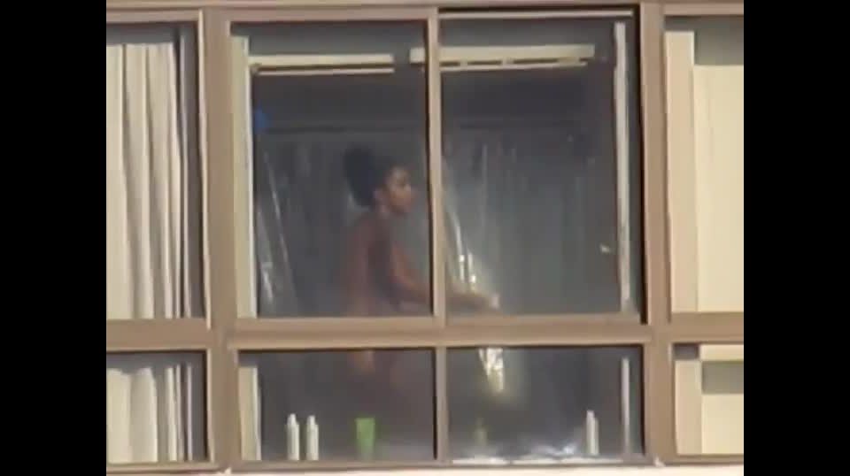 Black girl peeped while taking a shower