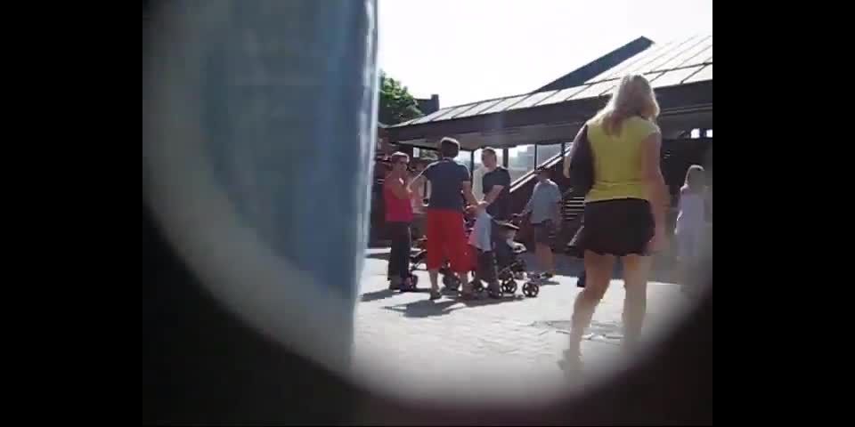 Short skirt spied on the moving  stairs