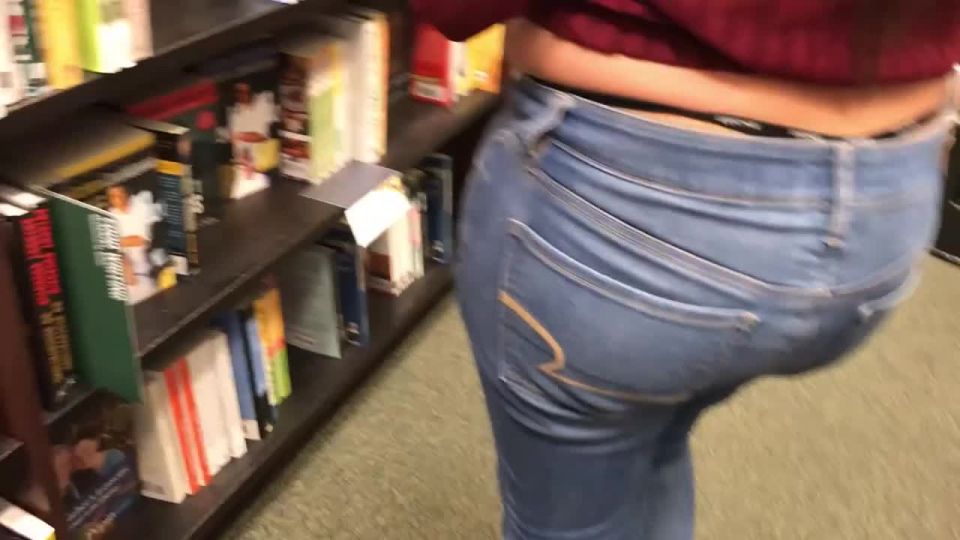 Chubby girl's thong slips out in the library