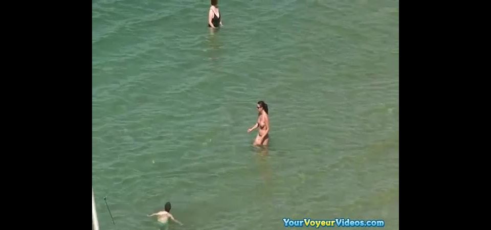 Topless women at beach