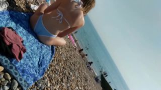Generous nipple slip caught on the beach