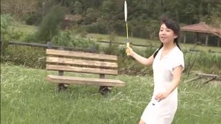 Pure Smile lovely Asian teen in braids poses outdoors International