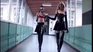 Latex Mistresses. Two latex Mistresses train their latex female slaves with crops and pony training