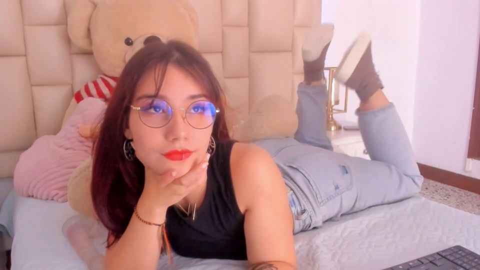 Redhead With Glasses Makes A Living In Erotic Webcam Shows