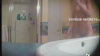 Teen girl showering in the  bathroom