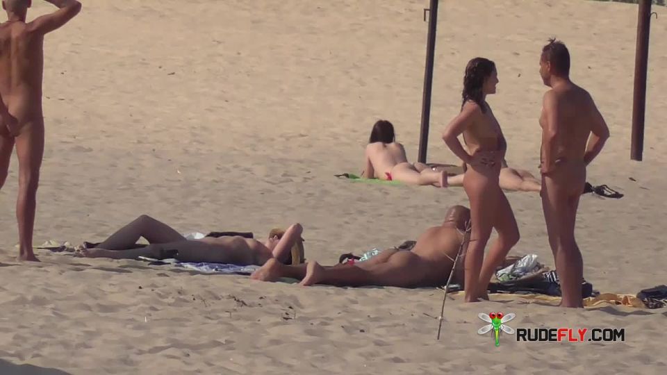 Slim girl with perky boobs naked at a nudist beach  3