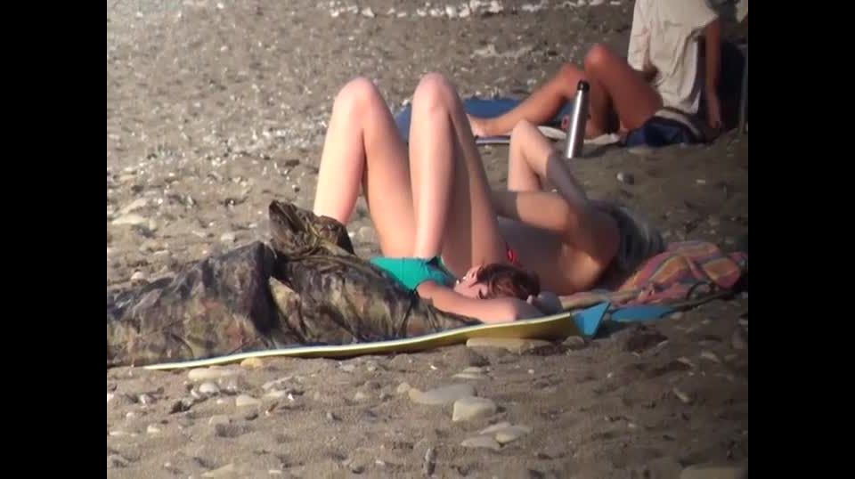 Topless babe voyeured on a  beach