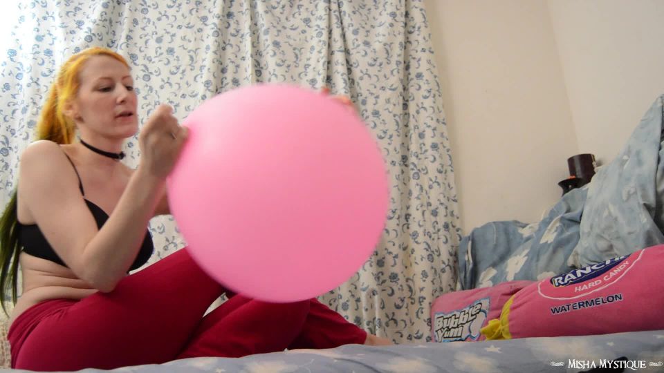 Misha mystique blowing up 16 inch balloon popping it