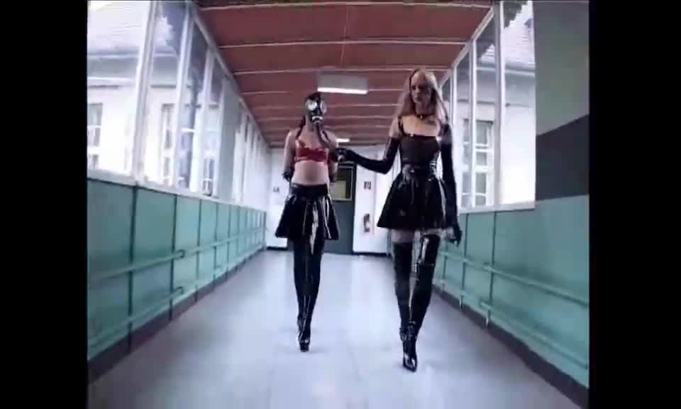 porn video 14 Latex Mistresses. Two latex Mistresses train their latex female slaves with crops and pony training on femdom porn fetish diva