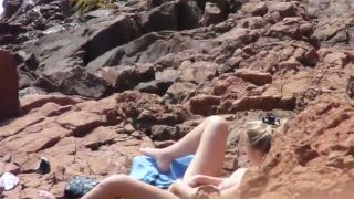 voyeur blonde girl fingering pussy on the beach