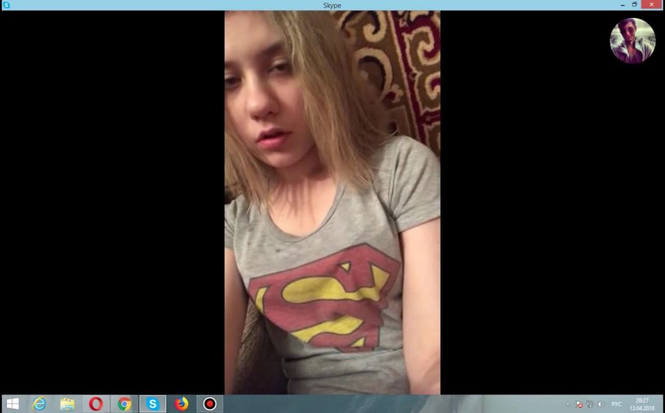 Young blonde with wet hair in a t-shirt Superman. 2018