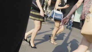 Young round butt in upskirt on street