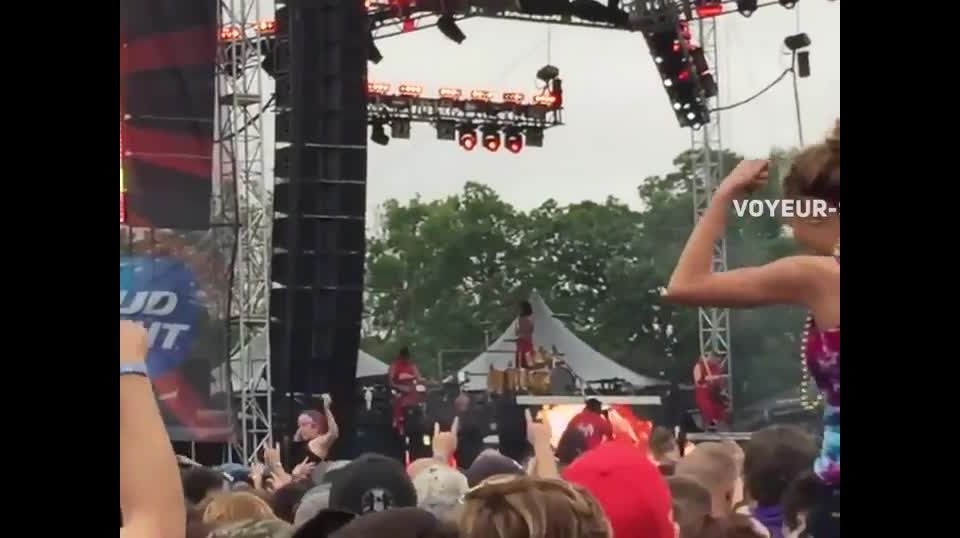 Hot girl flashes tits during a concert