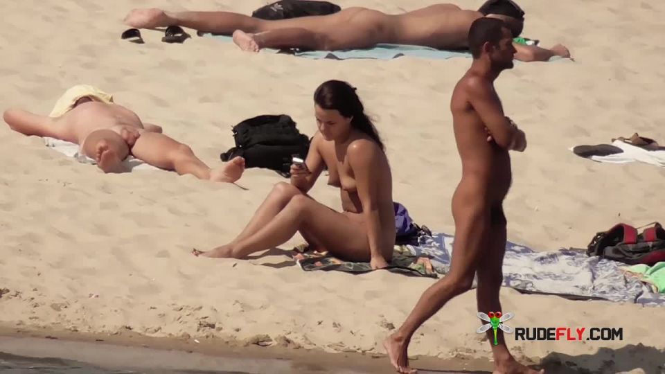Barely legal naturist babe lights up at the plage