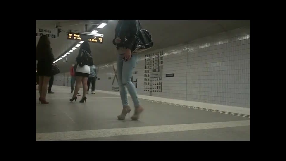 Perfect girl in high heels waits for  train