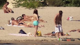 Nymph naturists get naked and heat up a public  strand