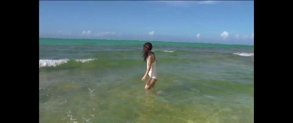 Miu lovely Asian teen enjoys the beach and the  water