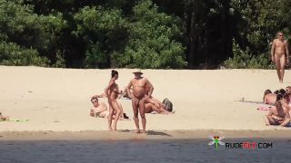 Naked teen naturist lets the water kiss her  body